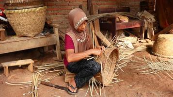 bamboo basket craftswoman while doing his work in a place, Batang, Jawa Tengah, Indonesia, May 26, 2019 photo