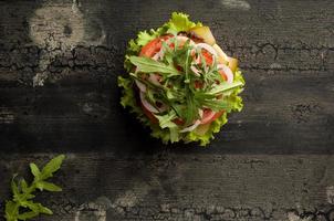 cheeseburger on a wooden surface photo