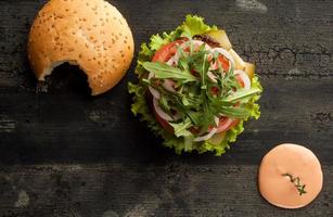 cheeseburger on a wooden surface photo