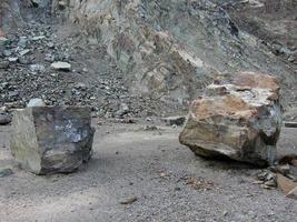 quarry for gravel extraction industry with two large rocks photo