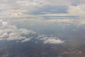 Blue sky with clouds on the airplane photo