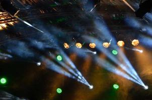 multicolored spotlights on a stage photo