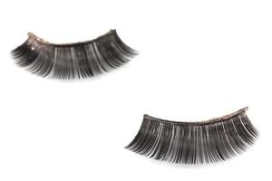 Use of  artificial eyelashes macro Isolated on white background photo