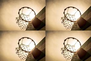 Wooden basketball hoop during sunset. photo