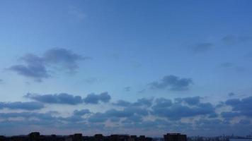 The beautiful sunset view with the silhouette and colorful clouds sky in the city photo