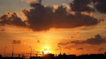 The beautiful sunset view with the silhouette and colorful clouds sky in the city photo