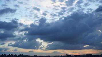 The beautiful sunset view with the silhouette and colorful clouds sky in the city photo