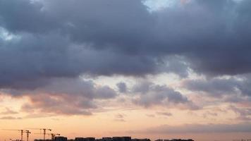 The beautiful sunset view with the silhouette and colorful clouds sky in the city photo
