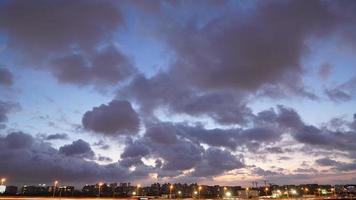 The beautiful sunset view with the silhouette and colorful clouds sky in the city photo