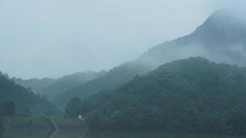 The beautiful mountains landscapes with the green forest and little village as background in the countryside of the China photo