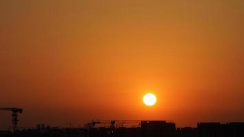 The beautiful sunset view with the silhouette and colorful clouds sky in the city photo