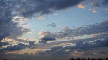 The beautiful sunset view with the silhouette and colorful clouds sky in the city photo