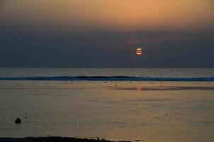 ocean and sunrise photo