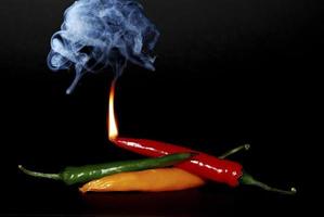 red pepper with flame and smoke photo