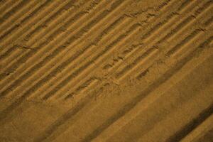 abstract brown paper luxury vintage futuristic texture with glossy elegant crack texture on brown. photo