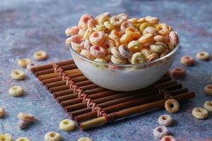 close up of colorful cereal corn flakes in a bowl photo