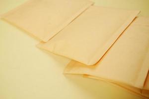 yellow paper bubble envelope on table photo