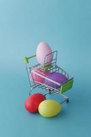 easter concept with multi color egg with a shopping art on color background photo