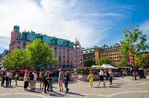 Sweden, Stockholm, May 30, 2018 Young people play, walking and spend time at Hotorget Square photo