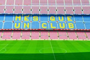 Barcelona, Spain, March 14, 2019 Camp Nou is the home stadium of football club Barcelona, the largest stadium in Spain. Top aerial view of tribunes stands and green grass field. photo