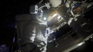 Astronaut outside the International Space Station on a spacewalk video