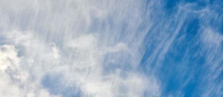 Cirrus clouds on blue sky, beautiful cirrus white clouds on blue day sky, bright cloudscape photo