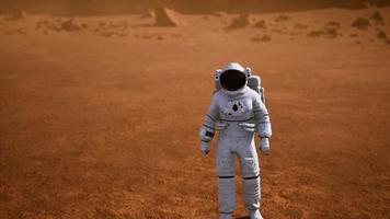 Astronaut on Mars Surface. Red Planet Covered in Gas and rock video