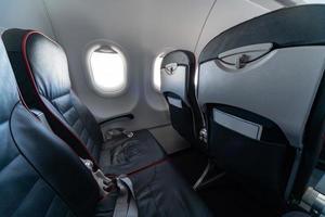 Airplane seats and windows, Economy class comfortable seats without passengers, New low-cost carrier airline photo