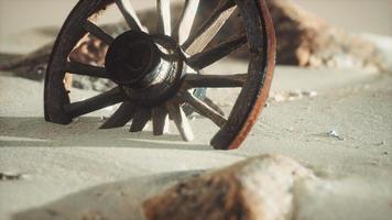 Large wooden wheel in the sand video