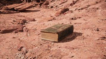 old book in red rock desert video