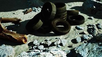 Old car tires on the beach video