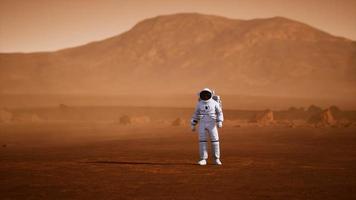 Astronaut on Mars Surface. Red Planet Covered in Gas and rock video