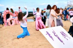 Improvisation drawing outdoor art performance with dancing girls, creative workshop, art festival photo