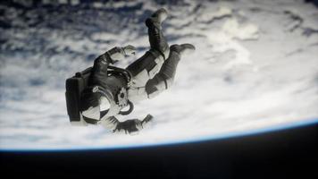 Astronaut floating above the Earth Elements of this image furnished by NASA video