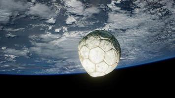 old soccer ball in space on Earth orbit video