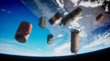 Space debris, pollution of the atmosphere of the planet Earth and space by human waste. Elements furnished by NASA video