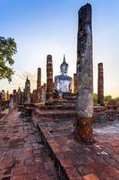 Silhouette Buddha Statue in Wat Mahathat Temple in Sukhothai Historical Park, Sukhothai Province, Thailand . photo