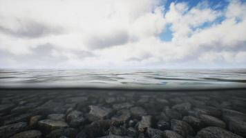 ocean seascape with sky and ocean wave splitted by waterline to underwater part video