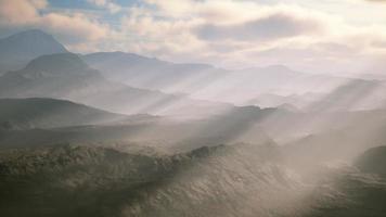 aerial vulcanic desert landscape with rays of light video