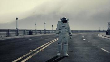 astronaut walks in the middle of a road video