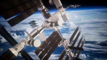 A view of the Earth and a spaceship. ISS is orbiting the Earth video