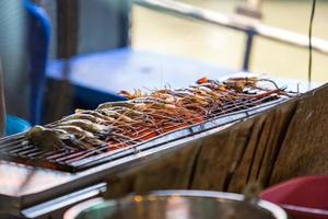 shrimp grilled seafood on stove. photo