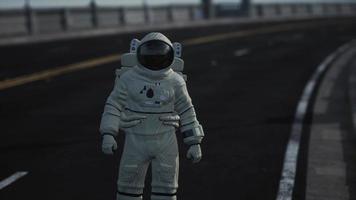 astronaut walks in the middle of a road video