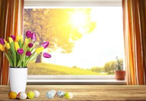 Beautiful Easter background with colorful tulips and easter eggs. photo