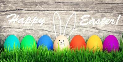 Easter background with colorful easter eggs on wooden background. photo