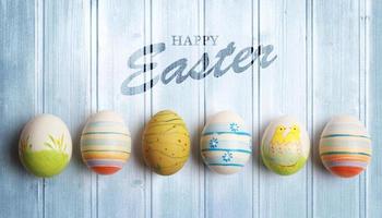 Easter background with colorful easter eggs on wooden background. photo