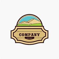 Beautiful mountain scenery logo design template. Natural mountain with green and wide savanna. Western Emblem Badge style logo vector
