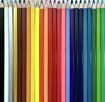 Color pencils set, row of wooden colored pencils isolated closeup, row of colored pencils for drawing photo