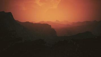 dramatic sky over rocky mountains at sunset video