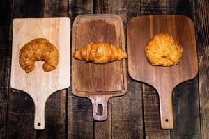 Croissant isolated in cutting board photo